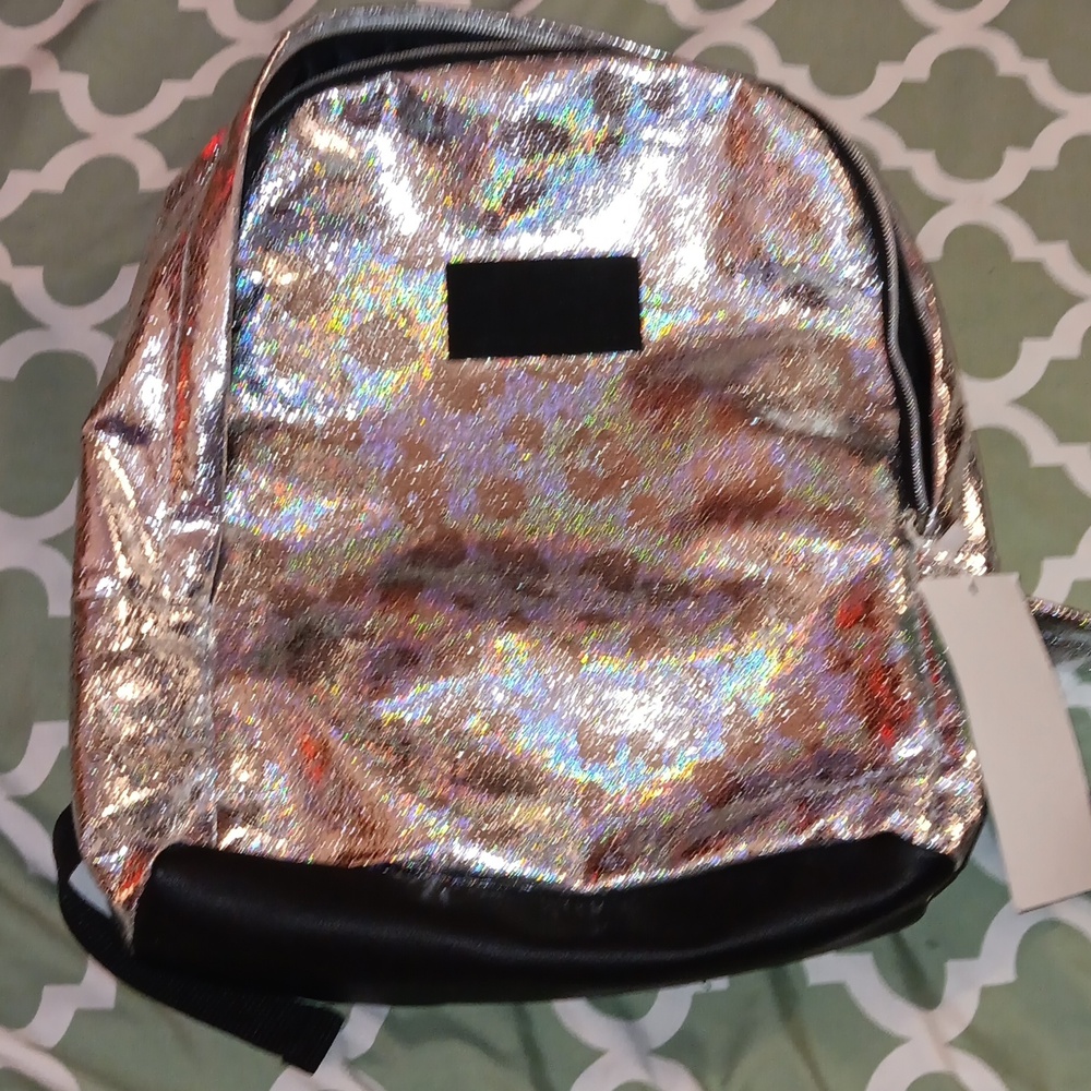 Kids TIGI mini backpack color changing depending on the lighting